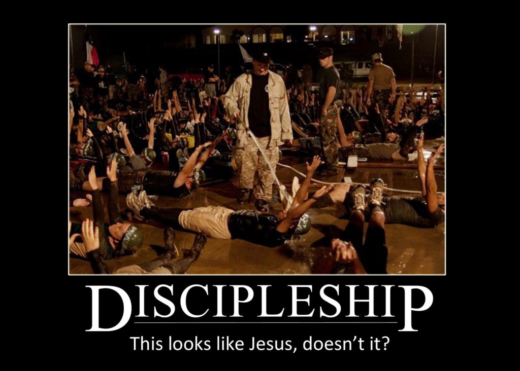 Dozens of interns lay in watery mud with their arms stretched up. In the forefront Heath Stoner sprays water on an intern while other facilitators walk around.

Image uses the old Demotivational Poster meme format with the caption "Discipleship: This looks like Jesus, doesn't it?"