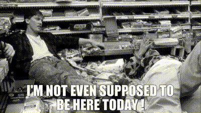 Dante Hicks and Randall Graves from Kevin Smith's movie Clerks collapse on the convenience store floor after a processed-food fight. Dante gives his iconic, "I'm not even supposed to be here today!" as he lies on the floor throwing his hands up in exasperation.